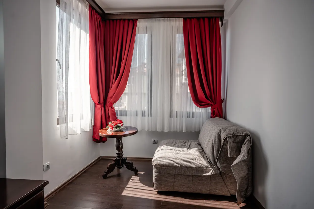Window corner with convertible chair bed and small table